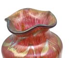 a glass vase that is sitting on a table