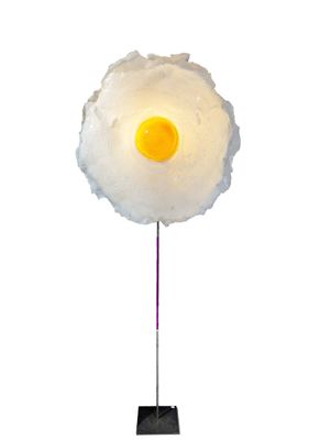 an image of a lamp with a fried egg on it