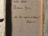 an old picture of a picture of a man in a suit and tie with writing on it
