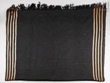 an image of a black and gold blanket with a design on it