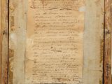 an old piece of paper with writing on it in a wooden frame