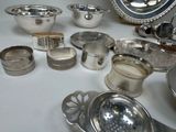 a table with a lot of silver items on it
