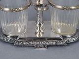 a silver tray with two glasses on it