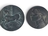 two bronze medallions depicting a woman and a horse