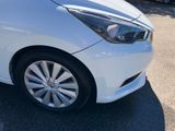 a picture of a white car parked in a parking lot