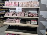 a lot of beauty products on the shelves in the store