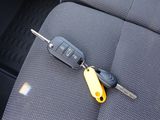 a car key that is attached to the back seat of a car