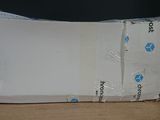 a box that has some papers in it on a table