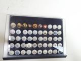 a display case with a lot of buttons in it