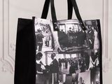 a black and white photo of a shopping bag with pictures on it