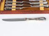 a box with a set of knives and a knife on it
