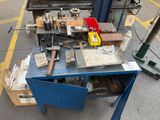 a table with tools on it in a parking lot