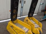 two yellow traffic lights sitting on top of each other