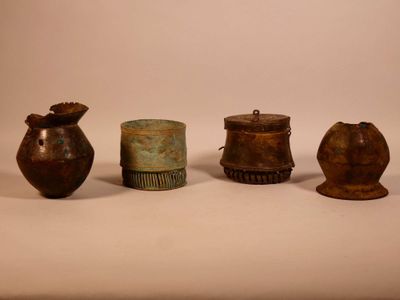 several different types of vases are sitting on a white surface