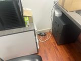 a desk with a chair and a computer monitor on it