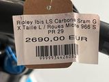 a label on the handlebar of a bicycle with a price tag attached to it