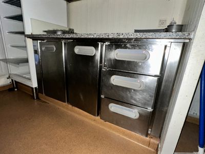 an image of a kitchen with stainless steel cabinets and granite counter tops