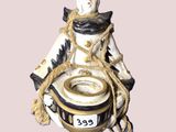 une figurine représentant un homme assis sur un pot