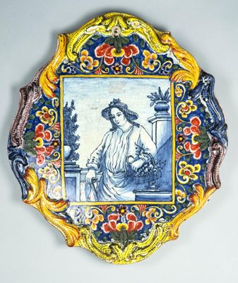 a decorative plate with a picture of a woman on it