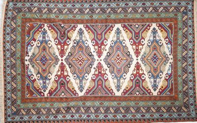 a rug with a multicolored design on a white background