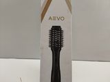 a box with a hair brush in it on a table