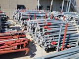 a lot of pipes that are sitting outside of a building