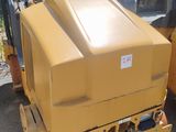 a large yellow machine that is sitting on a pallet