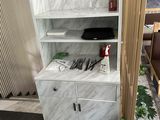 a bathroom with a sink and a cabinet in it