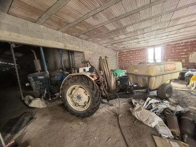 a tractor that is parked inside of a building