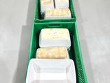 several plastic containers with food in them are lined up in a row