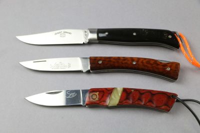 three different types of knives that are on a table