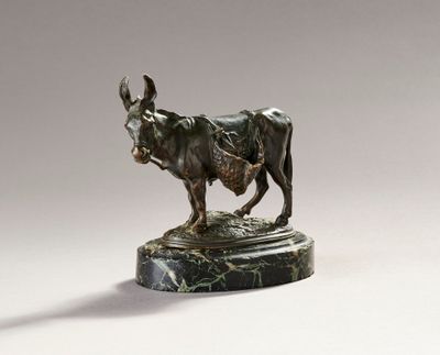 bronze statue of a bull on a marble base on a white background