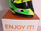 a helmet on top of a box that says enjoy it it ' s a schubberth