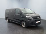a picture of a black van parked in a room