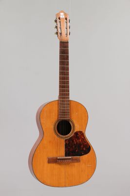 a close up of an acoustic guitar on a white background
