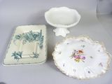 two plates and a bowl sitting on a table