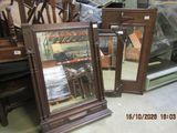 two mirrors sitting on the floor next to each other