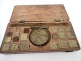 an old wooden box with a clock inside of it