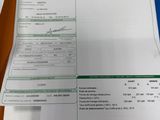 a document with a barcode on it sitting on a table