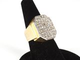 a close up of a ring on a black ring stand with a white background