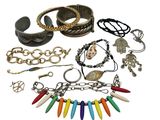 many different bracelets and bracelets on a white background