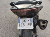 a motorcycle that is parked on the side of the road