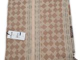 a brown and white towel with a tag on it