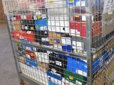 a metal cart with many boxes on it in a warehouse