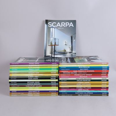 many books stacked on top of each other on a table