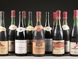 several bottles of wine are lined up in a row on a table