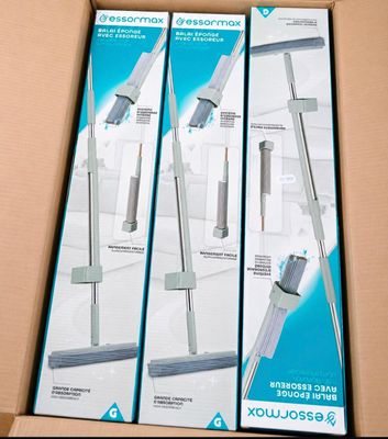 two boxes of vacuum cleaners sitting on top of a cardboard box