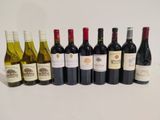 several bottles of wine are lined up in a row on a table