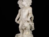 marble statue of a boy with a basket of flowers
