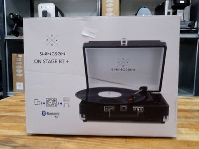 a box with a record player inside of it on a table